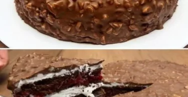 Torta lampone con ripieno di lampone e crema bianca decorata.