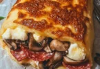 Rustico di Patate con farcitura di funghi, mozzarella e salame