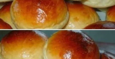 Panini al Latte appena sfornati su un tavolo di legno, ricetta facile da seguire.